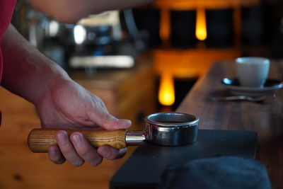 Cropped hand of man working at table