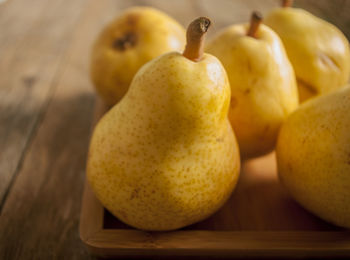 High angle view of pears in tray on table