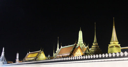 Panoramic view of temple building against sky at night