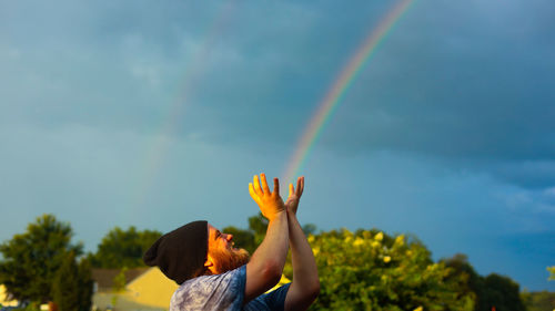 Low angle view of rainbow against sky