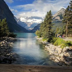 Scenic view of lake and mountains against sky