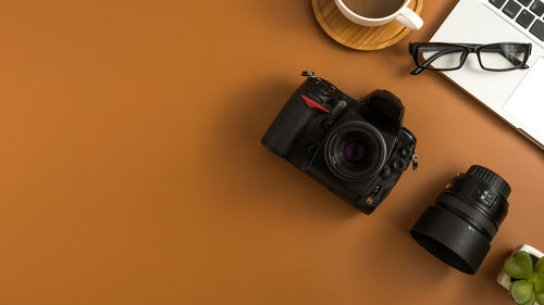 Close-up of camera on table