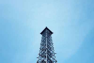 Low angle view of communications tower against sky