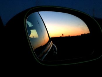 Close-up of cropped car at sunset