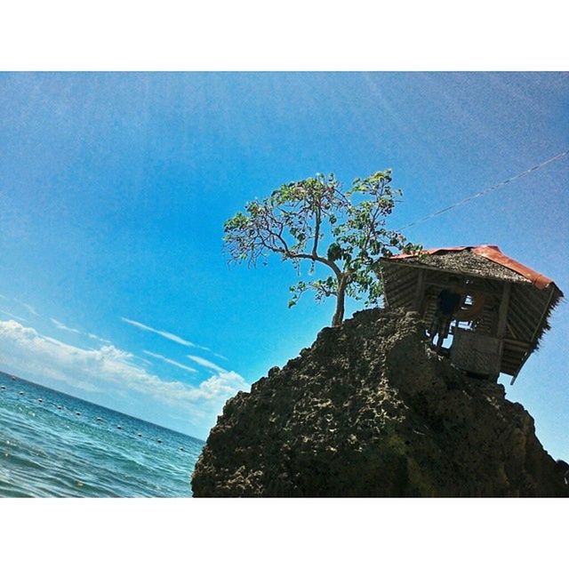 transfer print, built structure, architecture, building exterior, sky, sea, auto post production filter, water, horizon over water, house, blue, tree, day, beach, nature, sunlight, cloud, outdoors, residential structure, no people