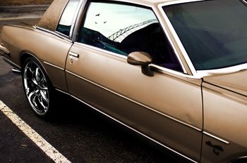 CLOSE-UP OF CARS ON MOTORCYCLE