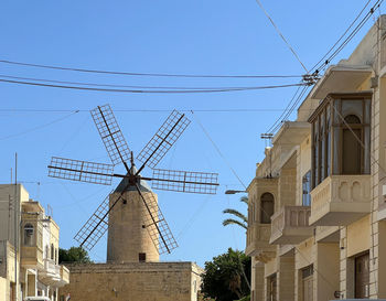 Low angle view of building against clear sky - windmill in gozo