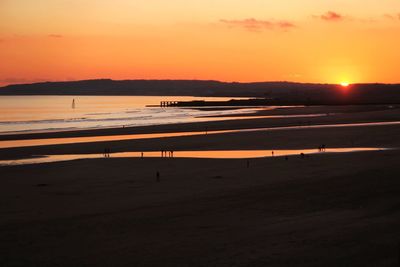 Scenic view of camber sands during sunset