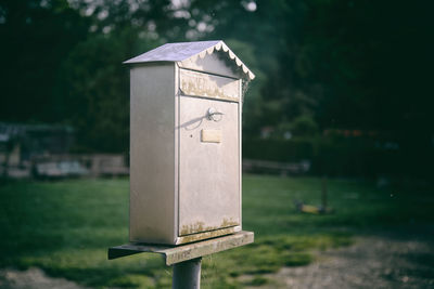Vintage posta mailbox with coutryside background