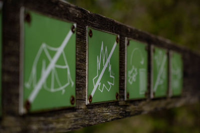 Close-up of sign board on tree