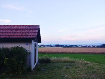 House on field against sky