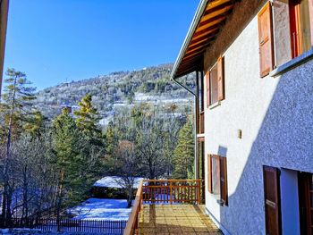 Scenic view of building and mountains against clear blue sky. briançon, french alps