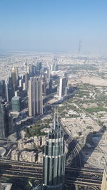 High angle view of buildings in city against clear sky