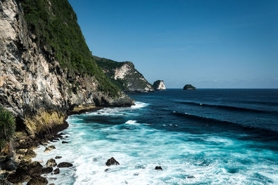 Scenic view of sea against blue sky