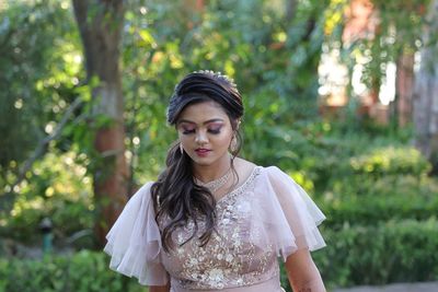 Portrait of a beautiful young woman standing outdoors