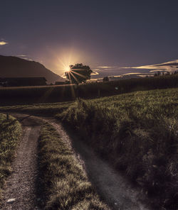 Scenic view of field against sky during sunset