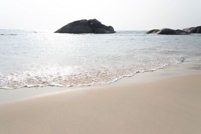 Scenic view of beach against clear sky