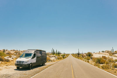 Sprinter van on isolated highway in the desert of baja, mexico.