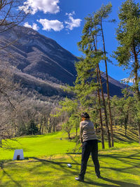 Rear view of man on golf course