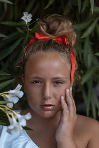 Close-up portrait of a serious young woman