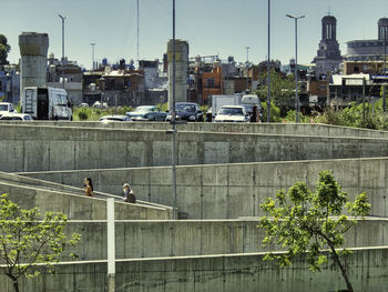 Street amidst buildings in city against sky