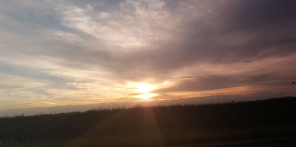 Scenic view of silhouette landscape against sky during sunset