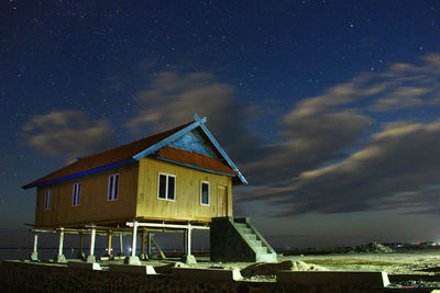 Low angle view of house against sky at night