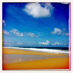 Scenic view of sea against cloudy sky