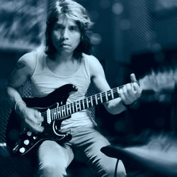 Full length of man playing guitar