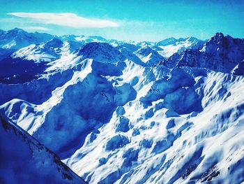 Scenic view of snowcapped mountains against sky