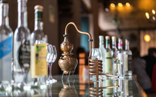 Glass of wine bottles on table at restaurant