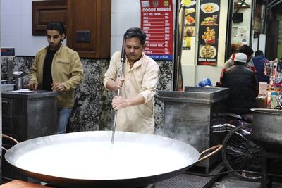 Group of people working at market