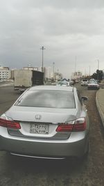 Cars on road against sky