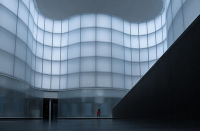 Person walking in modern building