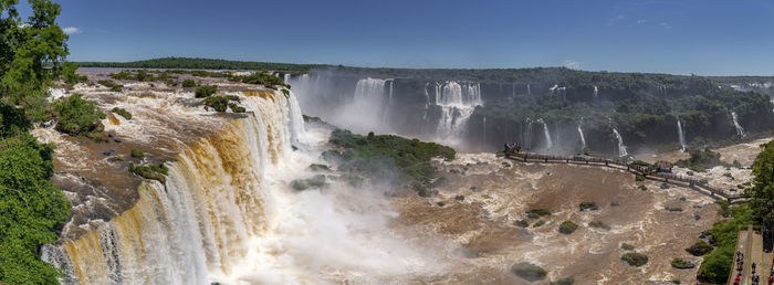 Panoramic view of waterfall against sky