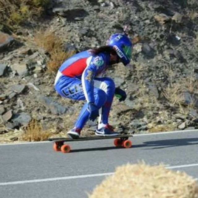 high angle view, blue, full length, street, road, day, sunlight, multi colored, outdoors, shoe, transportation, one person, childhood, toy, skateboard, asphalt, selective focus, shadow, footwear