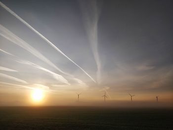 Scenic view of field against sky during sunset