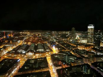 High angle view of illuminated buildings in city at night