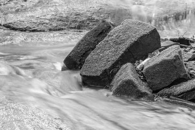 Scenic view of waterfall in sea