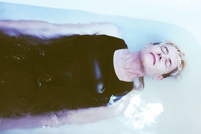 Portrait of woman relaxing in water