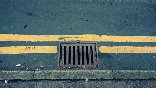 High angle view of manhole on street