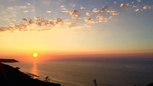 Scenic view of sea at sunset
