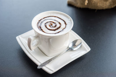 Close-up of coffee cup on table