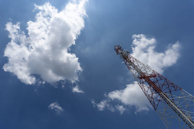 Low angle view of communications tower against sky