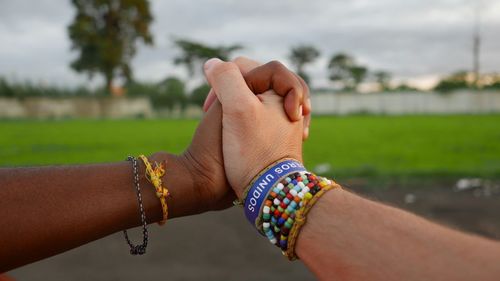 Close-up of intertwined hands