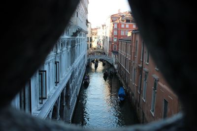 Canal amidst buildings in city