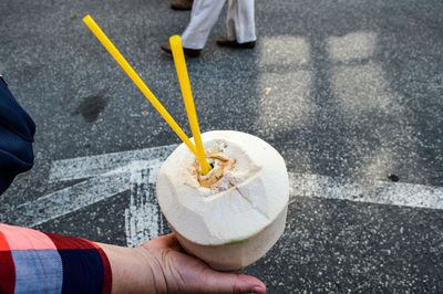 Low section of man standing on street