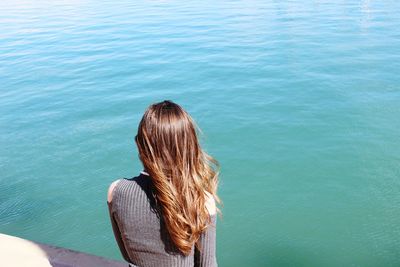 High angle view of woman looking at sea