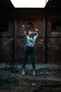 Full length of man standing in abandoned building