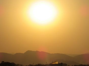 Silhouette mountains against sky during sunset